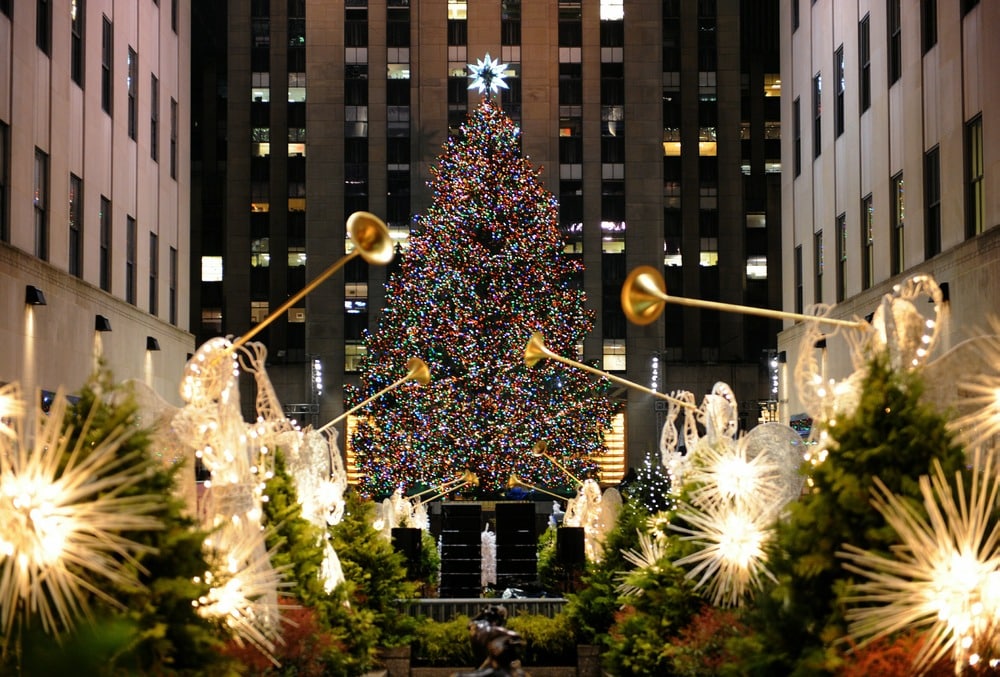 The Rockefeller Center Christmas Tree is lit on November 30, 2010 in New York. Originally from Mahopac, New York, the 12-ton, 74-foot Norway Spruce is adorned with 30,000 environmentally friendly LED lights on more than five miles of electrical wire, and topped with a Swarovski crystal star. AFP PHOTO / Stan Honda (Photo credit should read STAN HONDA/AFP/Getty Images)